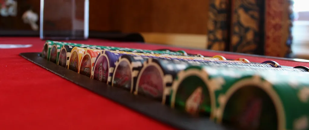 Rows of casino chips on a blackjack table