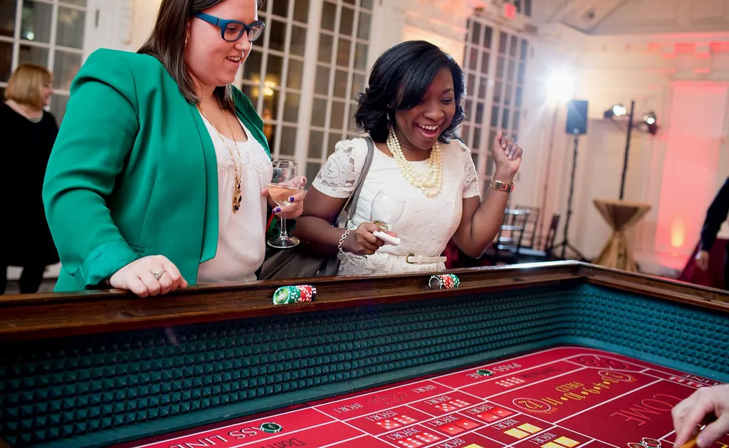 Two guests playing craps