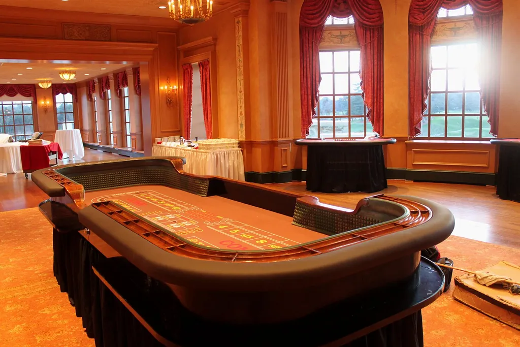 Craps table set near ballroom windows