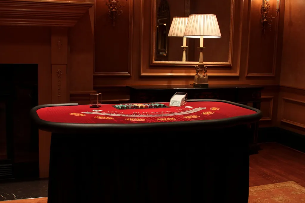 Blackjack table set beside a fireplace